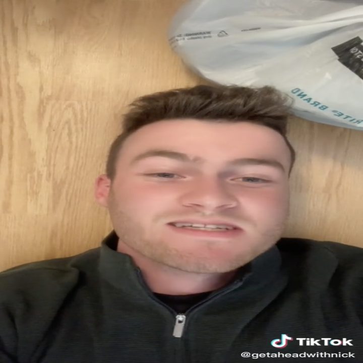 Screengrabs of a TikTok by user getaheadwithnick where he lies down on the floor