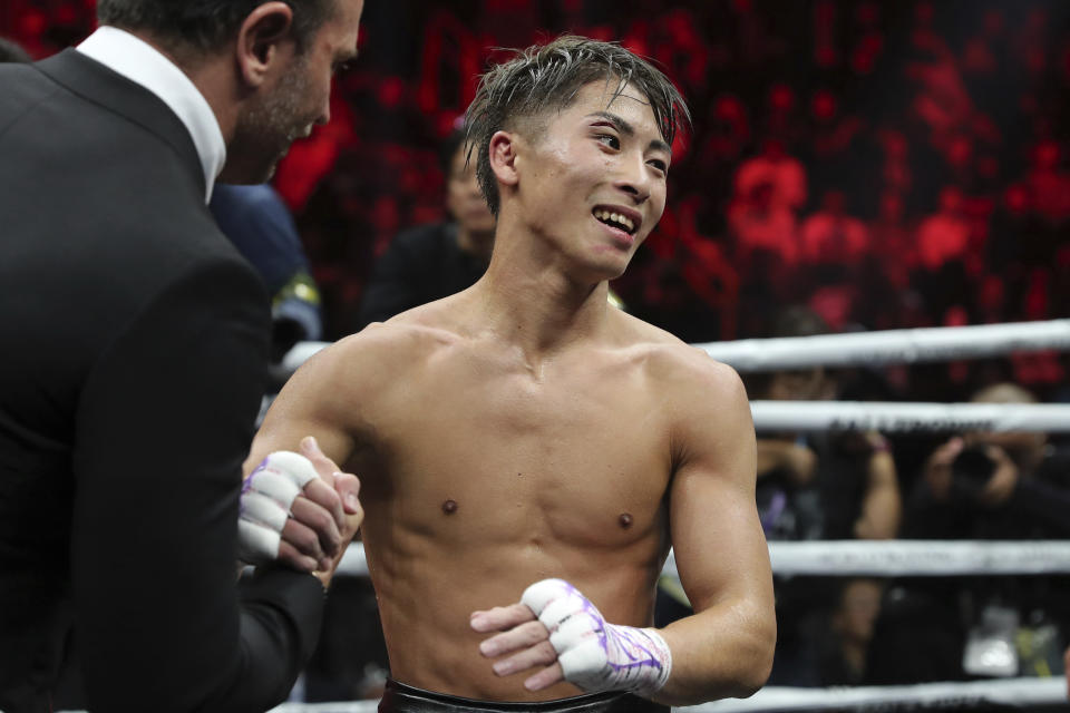 Japan's Naoya Inoue is congratulated after winning the World Boxing Super Series bantamweight final match in Saitama, Japan, Thursday, Nov. 7, 2019. Inoue beat Philippines' Nonito Donaire with a unanimous decision to win the championship. (AP Photo/Toru Takahashi)