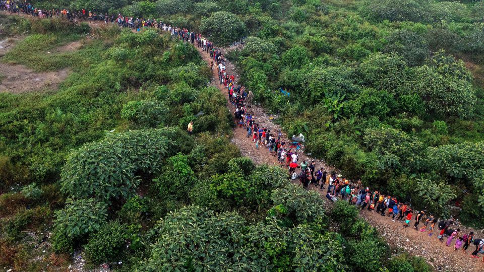 Migrants walking by the jungle near Bajo Chiquito village, the first border control of the Darien Province in Panama, on September 22, 2023. - Luis Acosta/AFP/Getty Images