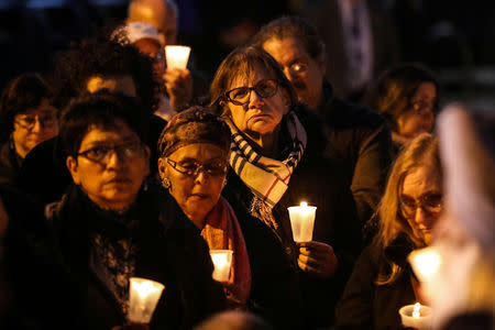People gather for a candlelight vigil held following a shooting at a Pittsburgh synagogue, in Queens, New York, U.S., October 29, 2018. REUTERS/Jeenah Moon