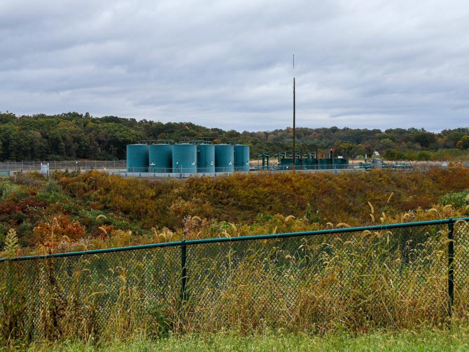 In this Oct. 17, 2019, photo, storage tanks are seen at a shale gas well pad in Zelienople, Pa.