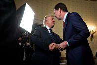 <p>JAN. 22, 2017 – President Donald Trump, left, shakes hands with James Comey, director of the Federal Bureau of Investigation (FBI), during an Inaugural Law Enforcement Officers and First Responders Reception in the Blue Room of the White House in Washington, D.C. Trump, on June 16, lashed out at the Justice Department official with authority over the special counsel probe of Russian election-meddling, and acknowledged that his firing of Comey as FBI director is a focus of the investigation. (Photo: Andrew Harrer-Pool/Getty Images) </p>