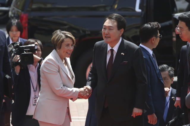 Mass. Governor Maura Healey greets South Korea's President Yoon Suk Yeol outside the Massachusetts State House, Friday, April 28, 2023, in Boston, Mass. Yoon stopped at the State House ahead of a talk at Harvard University as he wrapped up a state visit to the United States. (AP Photo/Reba Saldanha)