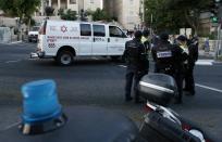 Israeli police cordon off the site where Yishai Shlissel, an ultra-orthodox Jew, stabbed six people taking part in a Gay Pride march in Jerusalem on July 30, 2015