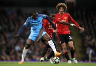 Manchester City's Yaya Toure (left) and Manchester United's Eric Bailly battle for the ball