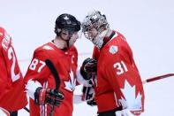 Sep 24, 2016; Toronto, Ontario, Canada; Team Canada goaltender Carey Price (31) celebrates with centre Sidney Crosby (87) after defeating Team Russia 5-3 during a semifinal game in the 2016 World Cup of Hockey at Air Canada Centre. Mandatory Credit: Kevin Sousa-USA TODAY Sports