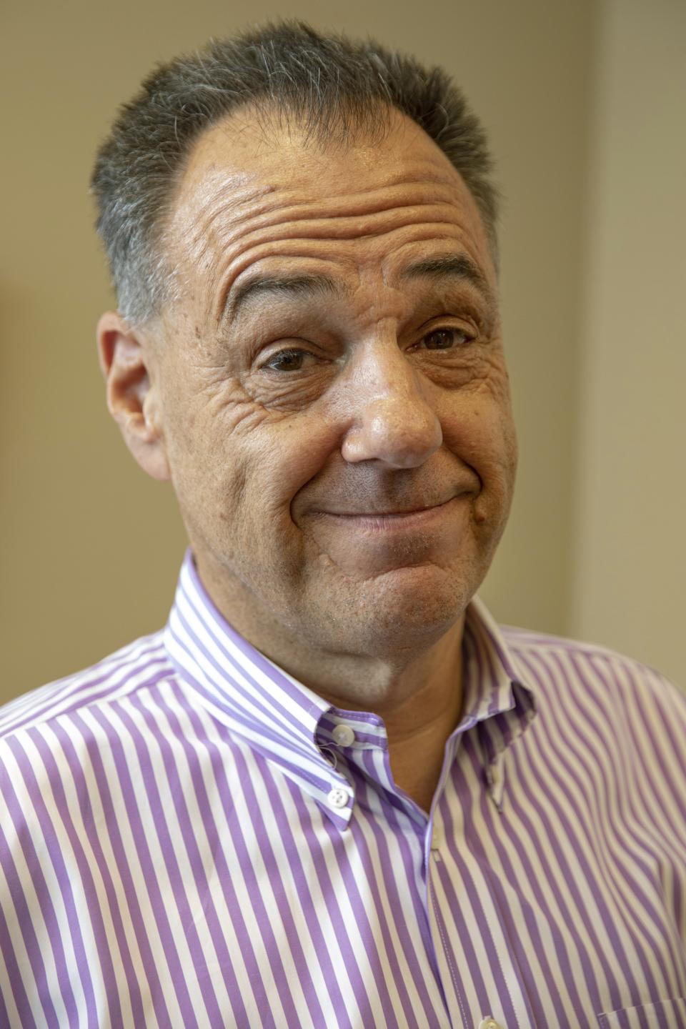 In this Tuesday, July 16, 2019 photo, Jeff Benach, co-owner of Lexington Homes poses for a portrait inside his office in Chicago. Lexington Homes, which has townhouse and single-family developments in the Chicago area, has been building smaller projects than in the past, Benach says. (AP Photo/Amr Alfiky)