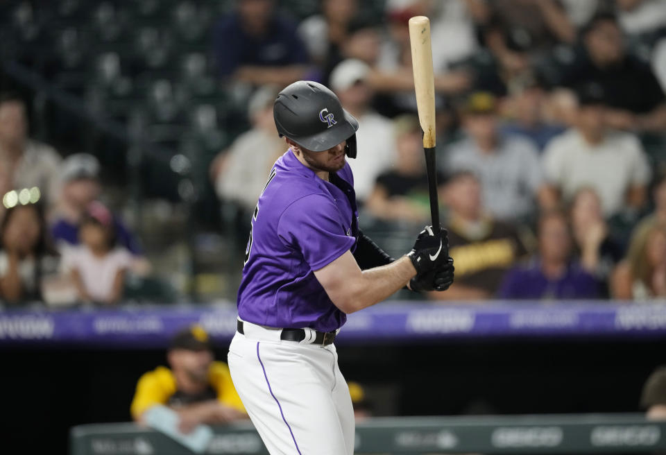 Colorado Rockies' C.J. Cron reacts as he grounds out against San Diego Padres relief pitcher Taylor Rogers to end the ninth inning of a baseball game Monday, July 11, 2022, in Denver. (AP Photo/David Zalubowski)