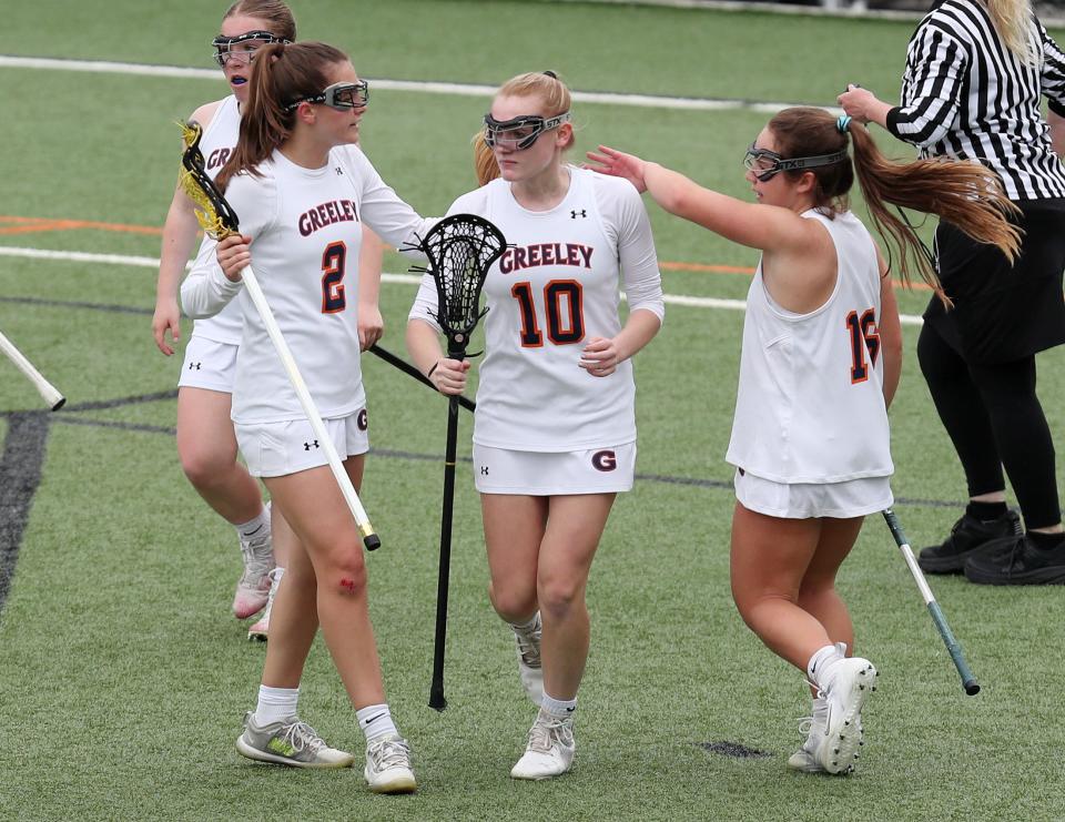 Erica Rosendorf (10) is congratulated after scoring during Greeley's 13-9 win over Fox Lane in girls lacrosse action at Horace Greeley High School in Chappaqua on May 4, 2022.