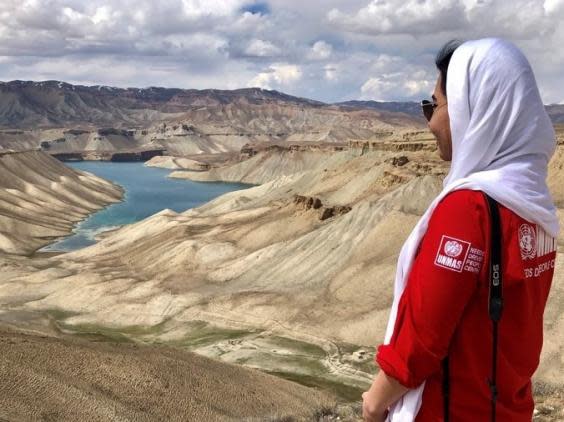 Makiz Nasirahmad, advocacy officer for UNMAS, in front of the Band-e Amir lake in Bamyan province (UNMAS Afghanistan)