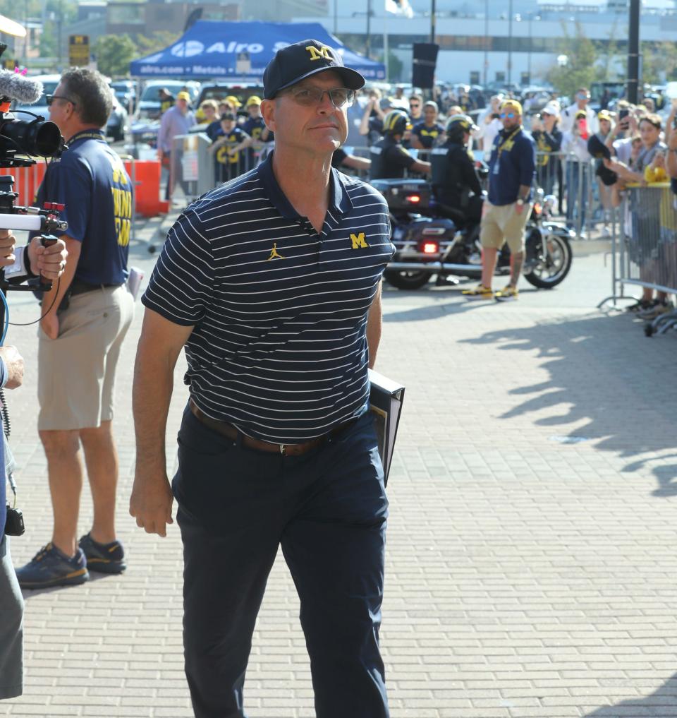 Michigan Wolverines head coach Jim Harbaugh arrives for his first game back after his three game suspension in Ann Arbor, Michigan on Saturday, Sept. 23 2023.