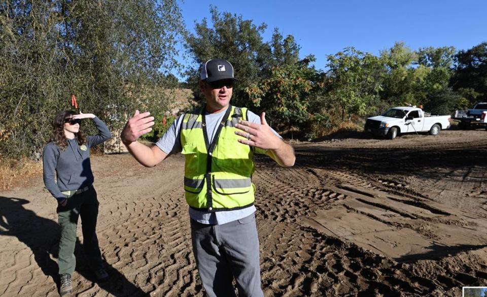 Project consultant Jesse Anderson, senior biologist for Cramer Fish Sciences, shows the site where a crew started work on a fishery restoration project along the Stanislaus River at Kerr Park in Oakdale, Calif., Tuesday, Oct. 3, 2023.