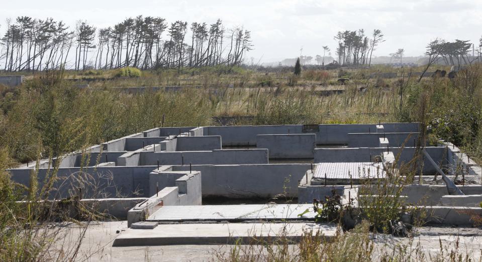 In this Oct. 9, 2012 photo, the foundation of a house is seen in a deserted land near the Arahama beach, severely damaged by the March 11, 2011 earthquake and tsunami, in Sendai, northeastern Japan. Japan's accounting of its budget for reconstruction from the disasters is crammed with spending on unrelated projects, while all along Japan's northeastern coast, dozens of communities remain uncertain of whether, when and how they will rebuild. (AP Photo/Koji Sasahara)