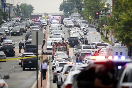 Police respond to reports of a shooting and subsequent lockdown at the U.S. Navy Yard in Washington July 2, 2015. REUTERS/Jonathan Ernst