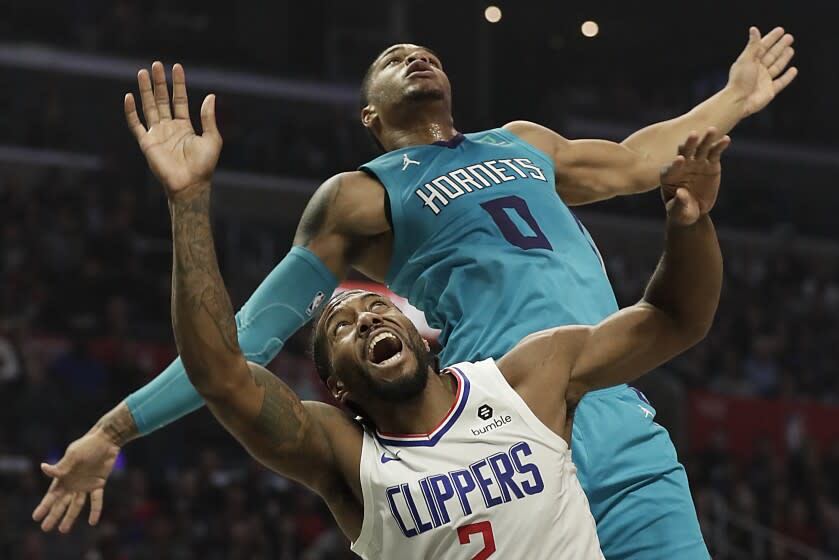 LOS ANGELES, CA, MONDAY, OCTOBER 28, 2019 - Charlotte Hornets forward Miles Bridges (0) blocks the dunk attempt of LA Clippers forward Kawhi Leonard (2) at Staples Center.(Robert Gauthier/Los Angeles Times)