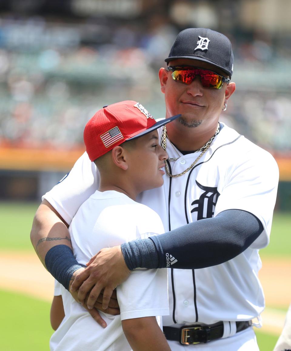 Detroit Tigers DH Miguel Cabrera (24) was honored for his 3,000 hits and 500 homers before the game against the Toronto Blue Jays on Sunday, June 12, 2022. Cabrera embraces his son, Christopher, after the ceremony.