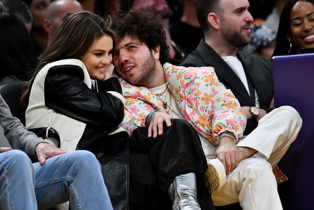 <p>Allen Berezovsky/Getty Images</p> Selena Gomez and Benny Blanco attend a basketball game between the Los Angeles Lakers and the Miami Heat.