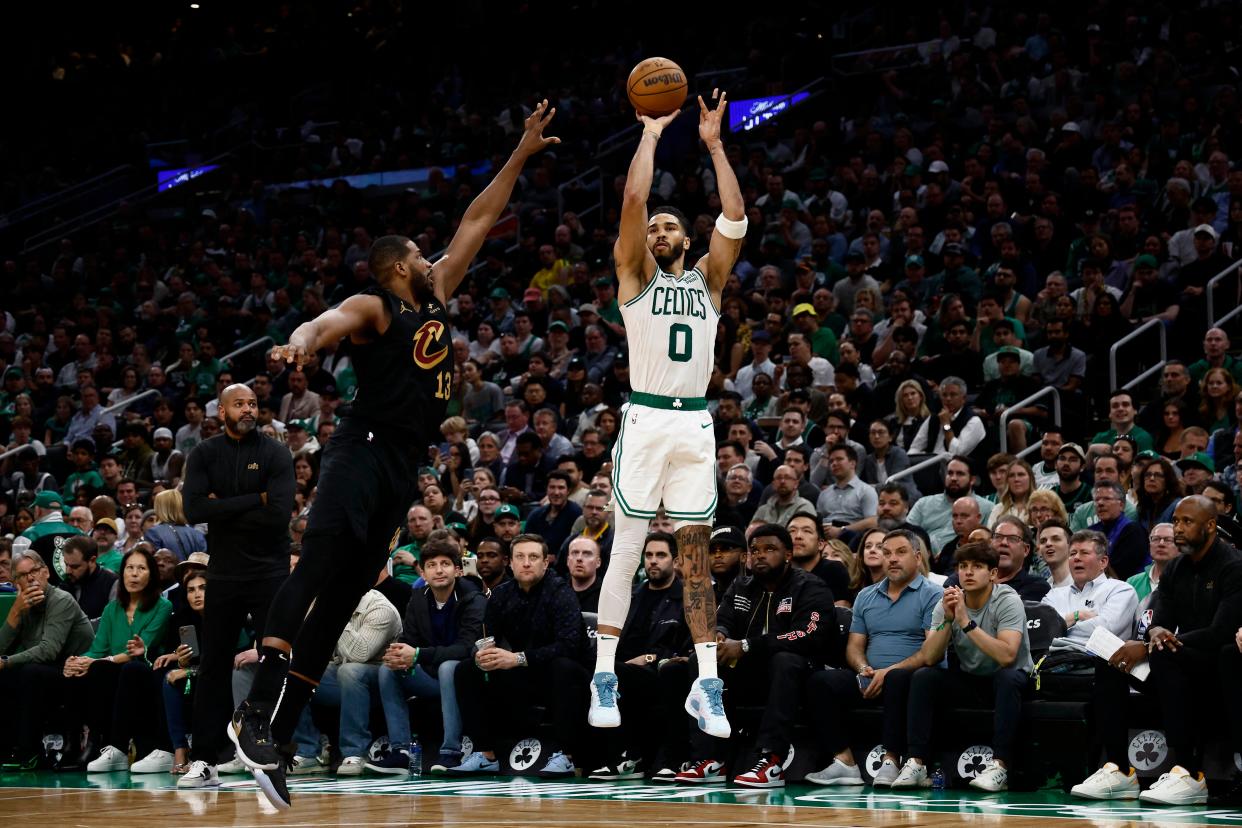 Boston Celtics forward Jayson Tatum (0) shoots against Cleveland Cavaliers center Tristan Thompson (13) during the third quarter of game one of the second round of the 2024 NBA playoffs at TD Garden.