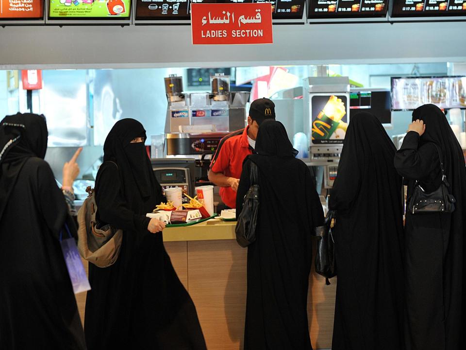 Saudi women wait in line in the 'ladies' section' at of a fast food restaurant in Riyadh, Saudi Arabia on 26 September 2011: Getty Images