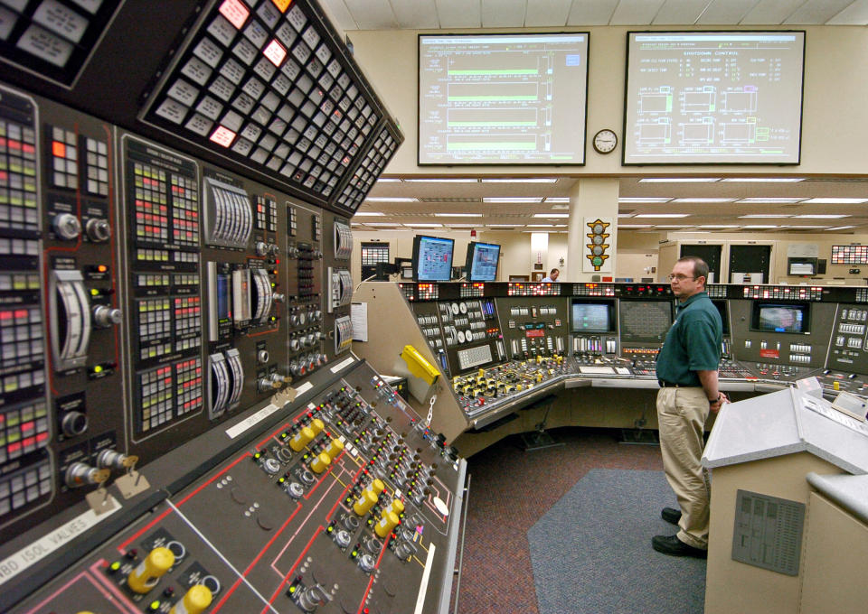 FILE – In this April 12, 2005, file photo, operator Kevin Holko monitors the control room during a scheduled refueling shutdown at the Perry Nuclear Power Plant in North Perry, Ohio. A federal court docket showed that "plea agreements" were filed Thursday, Oct. 29, 2020 for defendants Jeffrey Longstreth, a longtime political adviser, and Juan Cespedes, a lobbyist described by investigators as a "key middleman" in a $60 million bribery case also involving ex-Ohio House Speaker Larry Householder alleged to have helped prop up this aging nuclear power plant and the Davis-Besse Nuclear Power Station in Oak Harbor, Ohio. (AP Photo/Mark Duncan, File)