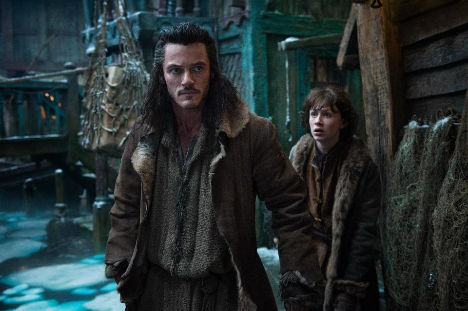 This image released by Warner Bros. Pictures shows Luke Evans, left, and John Bell in a scene from "The Hobbit: The Desolation of Smaug." (AP Photo/Warner Bros. Pictures, Mark Pokorny)