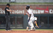 Umpire David Rackley (86) calls Atlanta Braves' Michael Harris II safe on a steal of second base during the fifth inning of the team's baseball game against the Pittsburgh Pirates on Saturday, June 11, 2022, in Atlanta. (AP Photo/Hakim Wright Sr.)