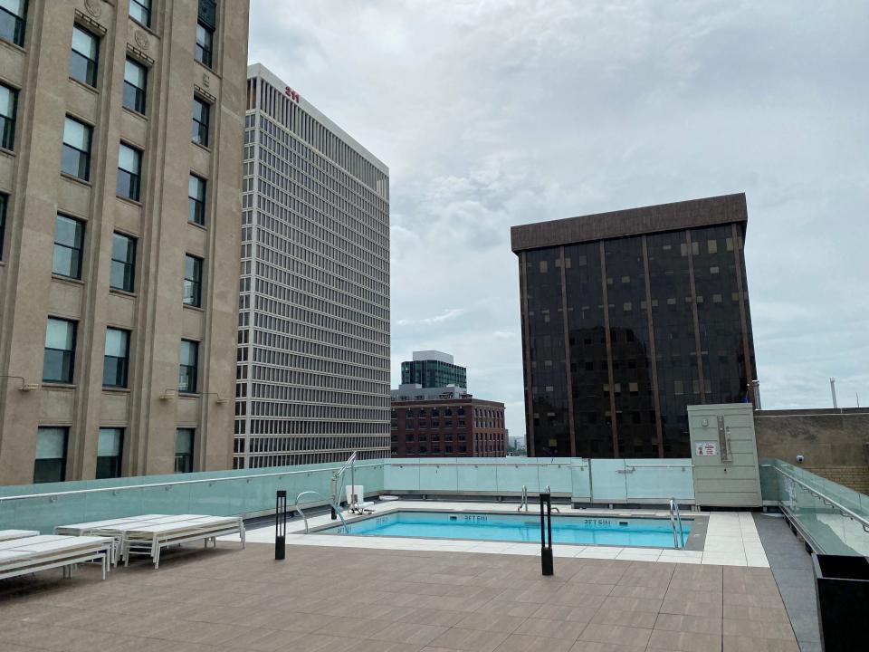 The pool at The Press/321 outside on the rooftop with buildings surrounding it