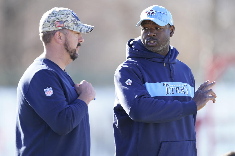 Tennessee Titans tight ends coach Tony Dews, right, talks with run game coordinator / running backs coach Justin Outten during an NFL football practice Thursday, Dec. 7, 2023, in Nashville, Tenn. (AP Photo/George Walker IV)