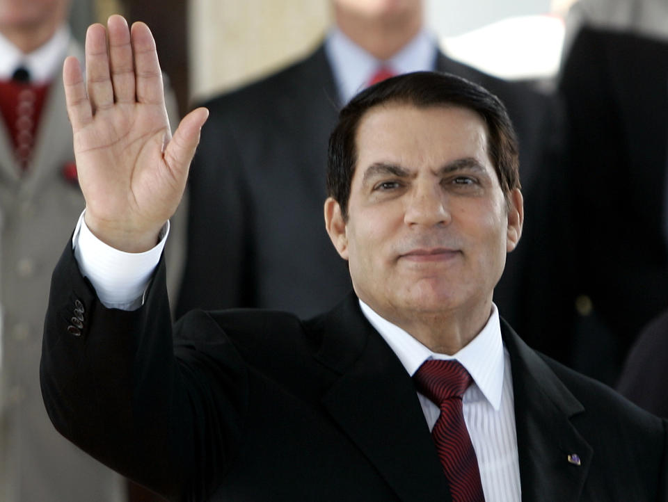 FILE - In this July 10, 2007 file photo, Tunisian President Zine El Abidine Ben Ali waves upon the arrival of French President Nicolas Sarkozy at Tunis airport. Tunisia's autocratic ruler Zine El Abidine Ben Ali, toppled in 2011, died in exile in Saudi Arabia. (AP Photo/Francois Mori, Pool, File)