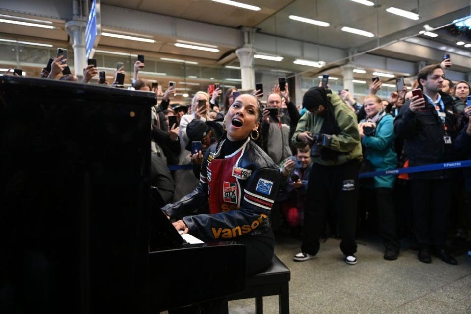 Alicia Keys performs on the Sir Elton John piano at St Pancras International Station on December 11, 2023 in London, England.