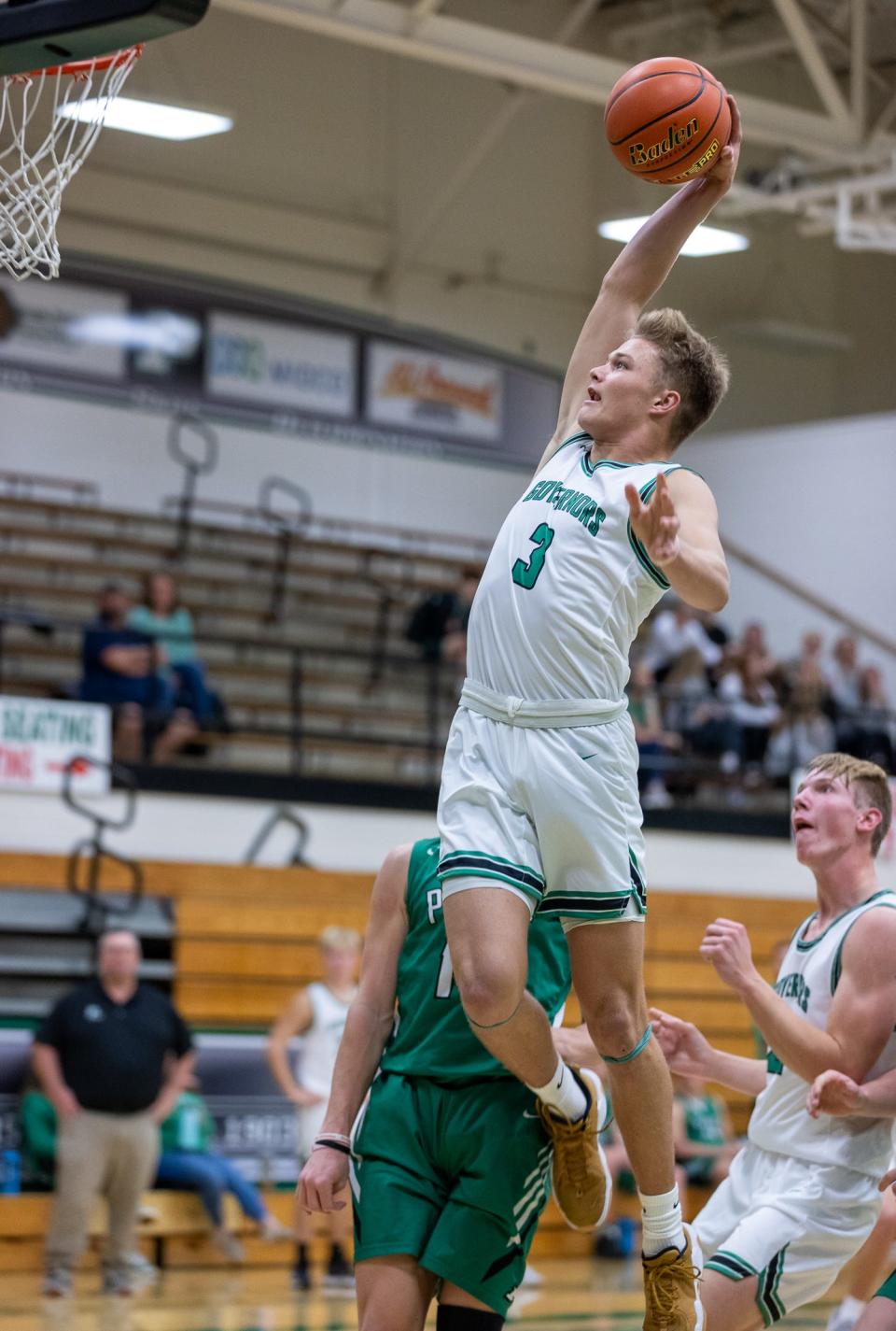 Pierre junior guard Lincoln Kienholz rises for a dunk.