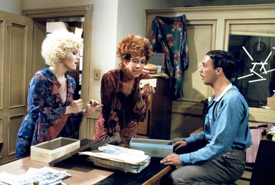 Bernadette Peters, Carol Burnett, and Tim Curry look for a locket