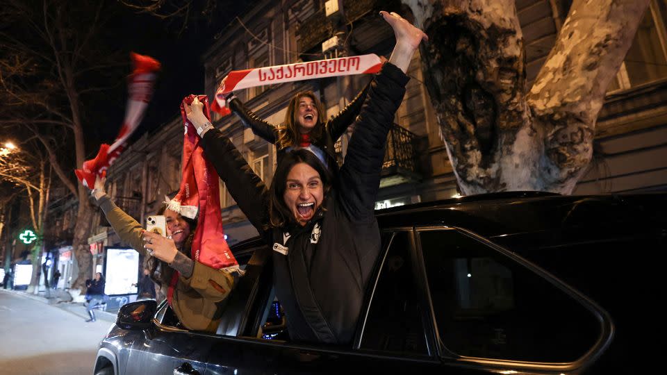 The celebrations continued into the streets of Tbilisi on Tuesday night. - Giorgi Arjevanidze/AFP/Getty Images