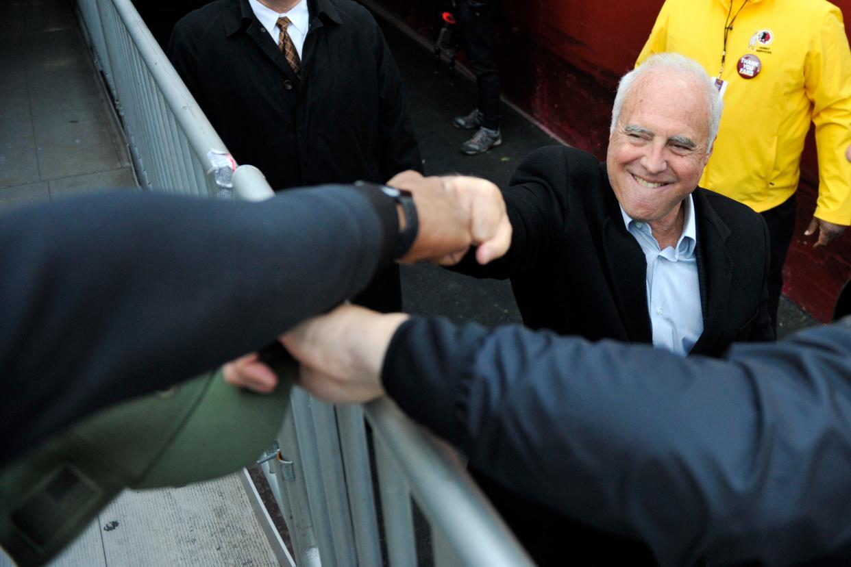 Philadelphia Eagles owner and seasonal Palm Beach resident Jeffrey Lurie fist bumps a fan before a 2018 game in Landover, Maryland.