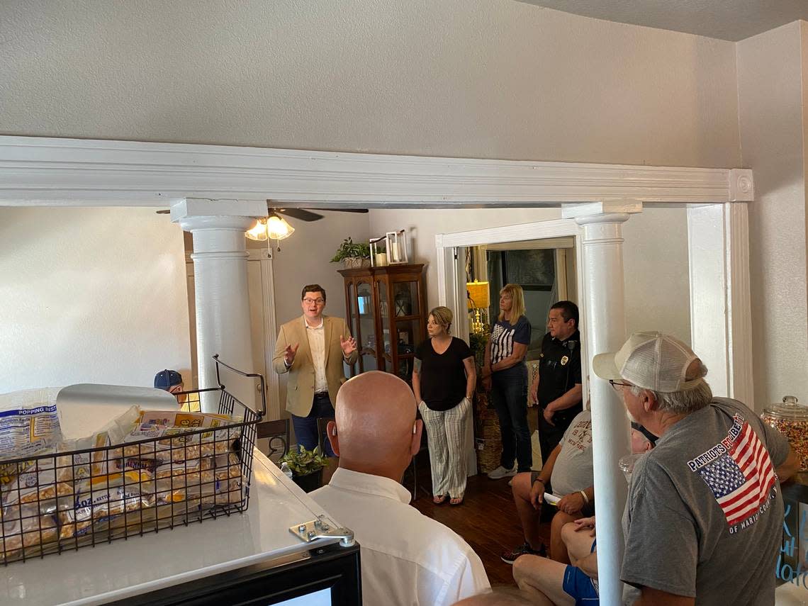 Marion restaurateur Kari Newell (center) hosted U.S. Rep Jake LaTurner at her coffee shop in early August. During the meet-and-greet, she asked that two journalists with the Marion County Record be escorted out. The Record’s newsroom was raided by police days later.