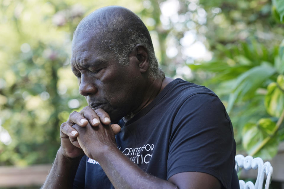 Marvin Dunn, professor emeritus at Florida Atlantic University, pauses during an interview, Thursday, Feb. 22, 2024, in Palmetto Bay, Fla. Dunn recalls childhood visits to his great-grandmother’s grave for the yearly spring clean-up, when he helped out marking the site with Coke bottles. “It was the ritual,” Dunn said. “My grandmother, especially, would not have allowed that grave not to be cleaned once a year.” (AP Photo/Marta Lavandier)