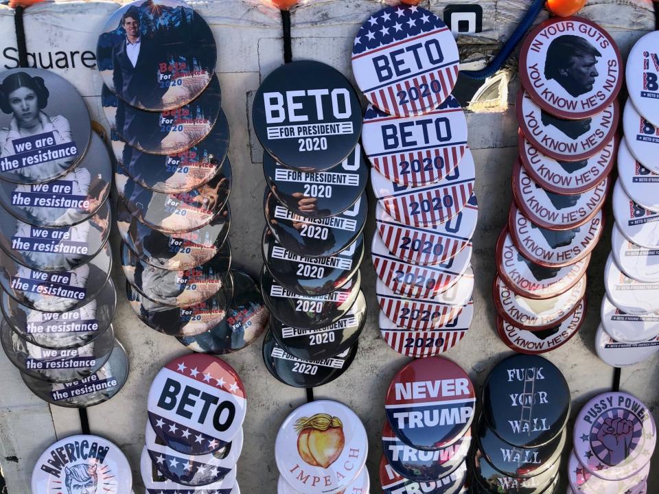 Buttons backing a presidential run by Beto O'Rourke are on sale Monday before his rally.