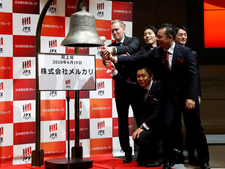 Mercari Inc. CEO Shintaro Yamada and his executives ring a bell during a ceremony to mark the company's debut on the Tokyo Stock Exchange in Tokyo, Japan, June 19, 2018. REUTERS/Kim Kyung-Hoon