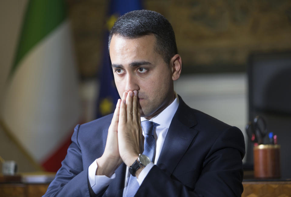 Italian Foreign Minister Luigi Di Maio listens to questions during an interview with The Associated Press in his studio in Rome, Tuesday, Feb. 4, 2019. Di Maio says there is no risk his country will leave the European Union but is calling for reforms to give more weight to European lawmakers since they are directly elected by citizens. (AP Photo/Domenico Stinellis)