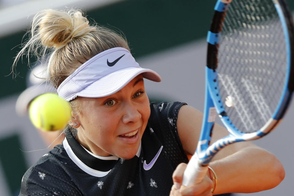 Amanda Anisimova of the U.S. plays a shot against Spain's Aliona Bolsova during their fourth round match of the French Open tennis tournament at the Roland Garros stadium in Paris, Monday, June 3, 2019. (AP Photo/Christophe Ena)