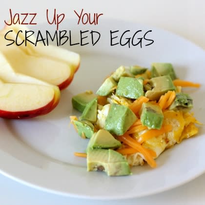 <div class="caption-credit"> Photo by: Spoonful</div><div class="caption-title">Jazz Up Your Scrambled Eggs</div><i><b>Ingredients:</b></i> <br> 1 Egg <br> 1 ounce shredded cheese (I like sharp cheddar) <br> 1/2 avocado, diced <br> 1 teaspoon onion, very finely diced <br> 1 teaspoon butter <br> Salt and pepper <br> <br> <i><b>Directions:</b></i> <br> In a small frying pan, melt butter. When it's hot, add onion and sautee until soft, about two minutes. <br> <br> Crack egg into pan. Sprinkle lightly with salt and pepper. Let cook, without stirring, 1-2 minutes, until the white part is mostly cooked through. <br> <br> Stir the egg briefly, breaking the yolk and mixing the white and yellow parts gently. Cook 1 more minute or until it's mostly set (don't cook it until it's completely set or it will overcook once you take it off the stove). <br> <br> Put egg on a plate, sprinkle the shredded cheese on top, and top with diced avocado. Serve immediately.