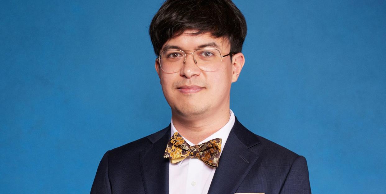 phil wang wearing a suit during a portrait for national comedy awards for stand up to cancer