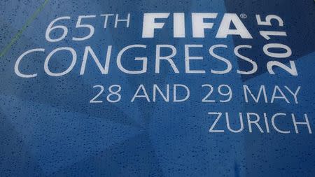 Raindrops cover a sign outside the Hallenstadion, the venue of the upcoming 65th FIFA Congress in Zurich, Switzerland, May 26, 2015. Reuters/Arnd Wiegmann