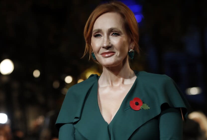 FILE - In this Thursday, Nov. 8, 2018 file photo, writer J.K. Rowling poses for the media at the world premiere of the film "Fantastic Beasts: The Crimes of Grindelwald" in Paris. Dozens of artists, writers and academics have signed an open letter decrying the weakening of public debate, it was announced Wednesday, July 8, 2020 warning that the free exchange of information and ideas is in jeopardy. J.K. Rowling, Salman Rushdie and Margaret Atwood are among dozens of writers, artists and academics to argue against ideological conformity in an open letter in Harper's Magazine. The letter comes amid a debate over so-called cancel culture - where prominent people face attack for sharing controversial opinions. (AP Photo/Christophe Ena, file)