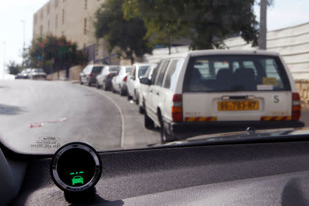 FILE PHOTO: A device, part of the Mobileye driving assist system, is seen on the dashboard of a vehicle during a demonstration for the media in Jerusalem October 24, 2012. REUTERS/Baz Ratner/File Photo