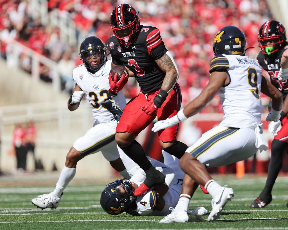 Utah Utes running back Ja’Quinden Jackson (3) runs over California Golden Bears defensive back Kaylin Moore (4) on Saturday, Oct. 14, 2023.