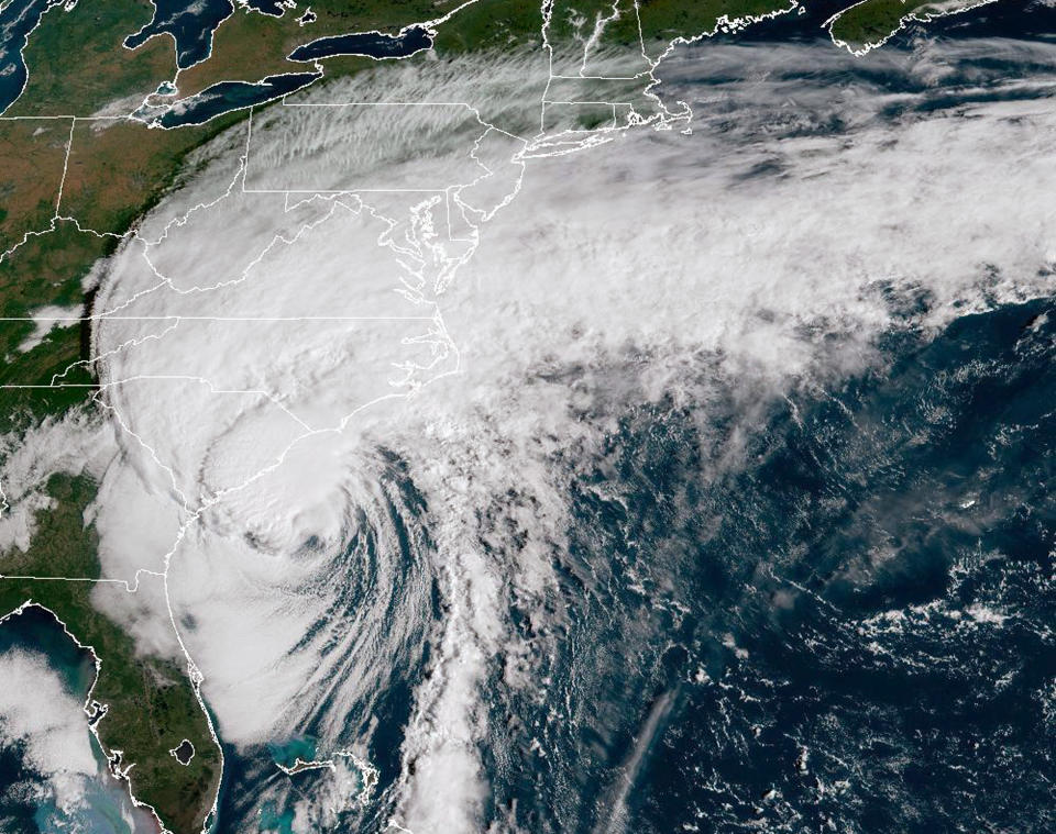 A NOAA handout image shows a powerful weather system with its epicenter off the coast of South Carolina.