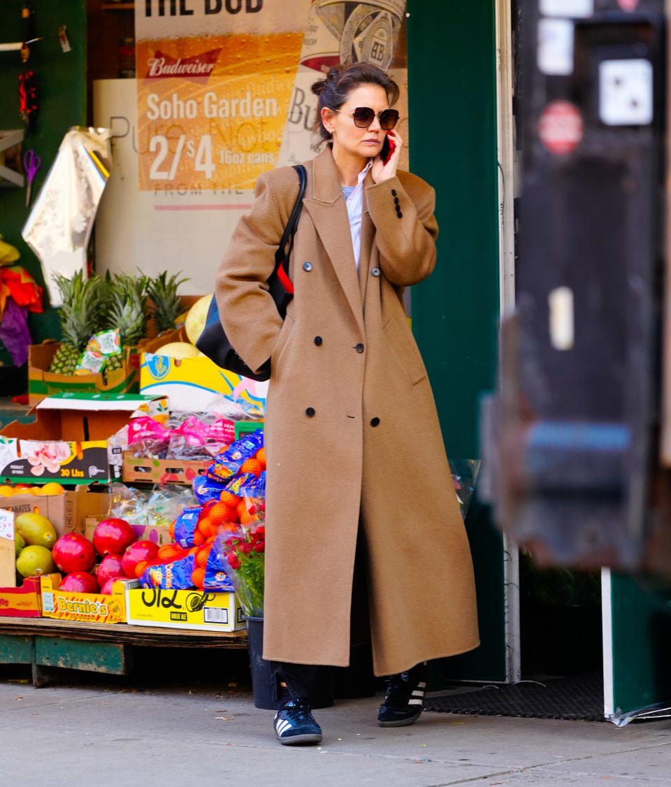 Katie Holmes wearing a camel coat in NYC