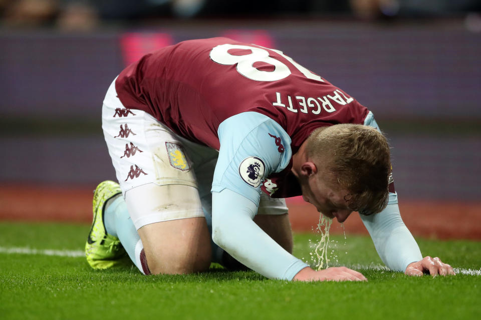 Aston Villa's Matt Targett appears to be sick on the pitch during the Premier League match at Villa Park, Birmingham. (Photo by Nick Potts/PA Images via Getty Images)