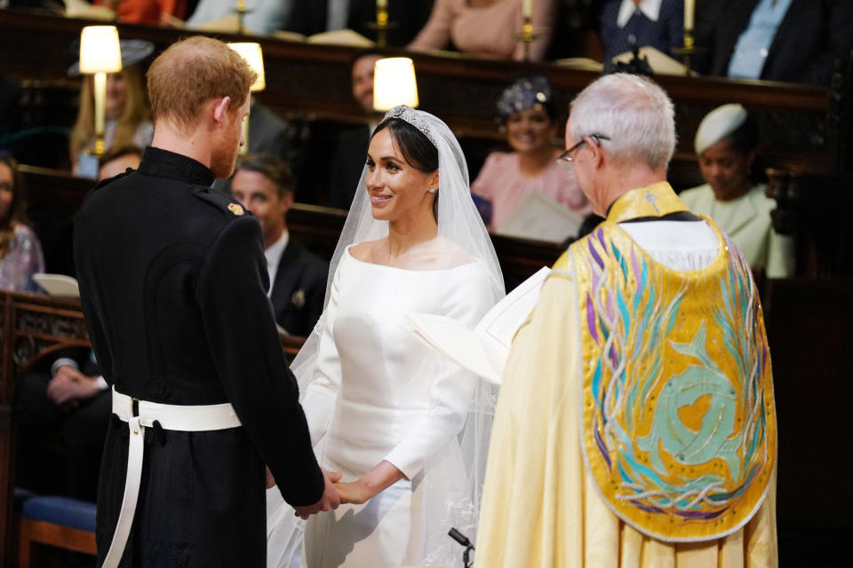 The pair were all smiles as they read their vows to one another. Source: AP